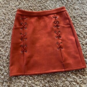 NWOT lace up suede mini skirt sz M.